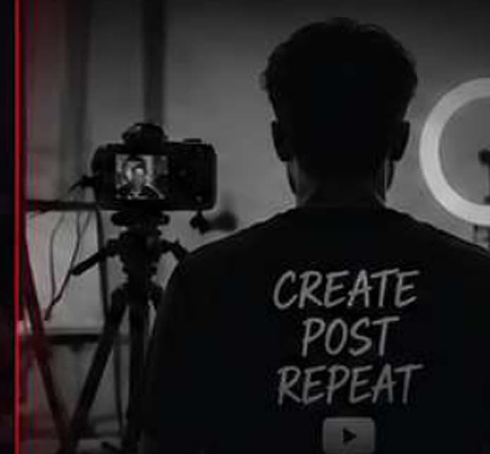 Creator filming themselves with a camera and ring light